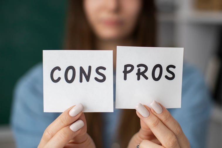 blurry-woman-holding-cons-pros-post-its
