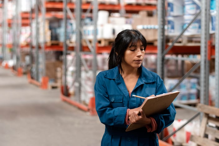 woman-worker-taking-notes-warehouse