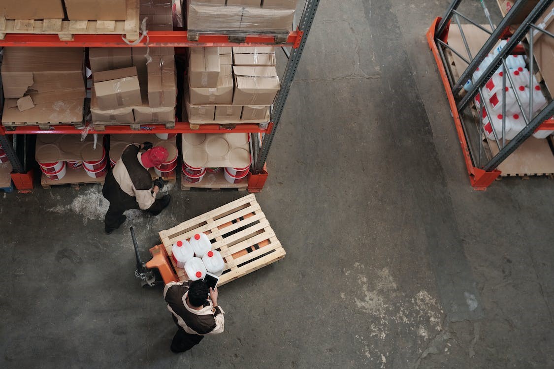 Free Men Working in a Warehouse Stock Photo